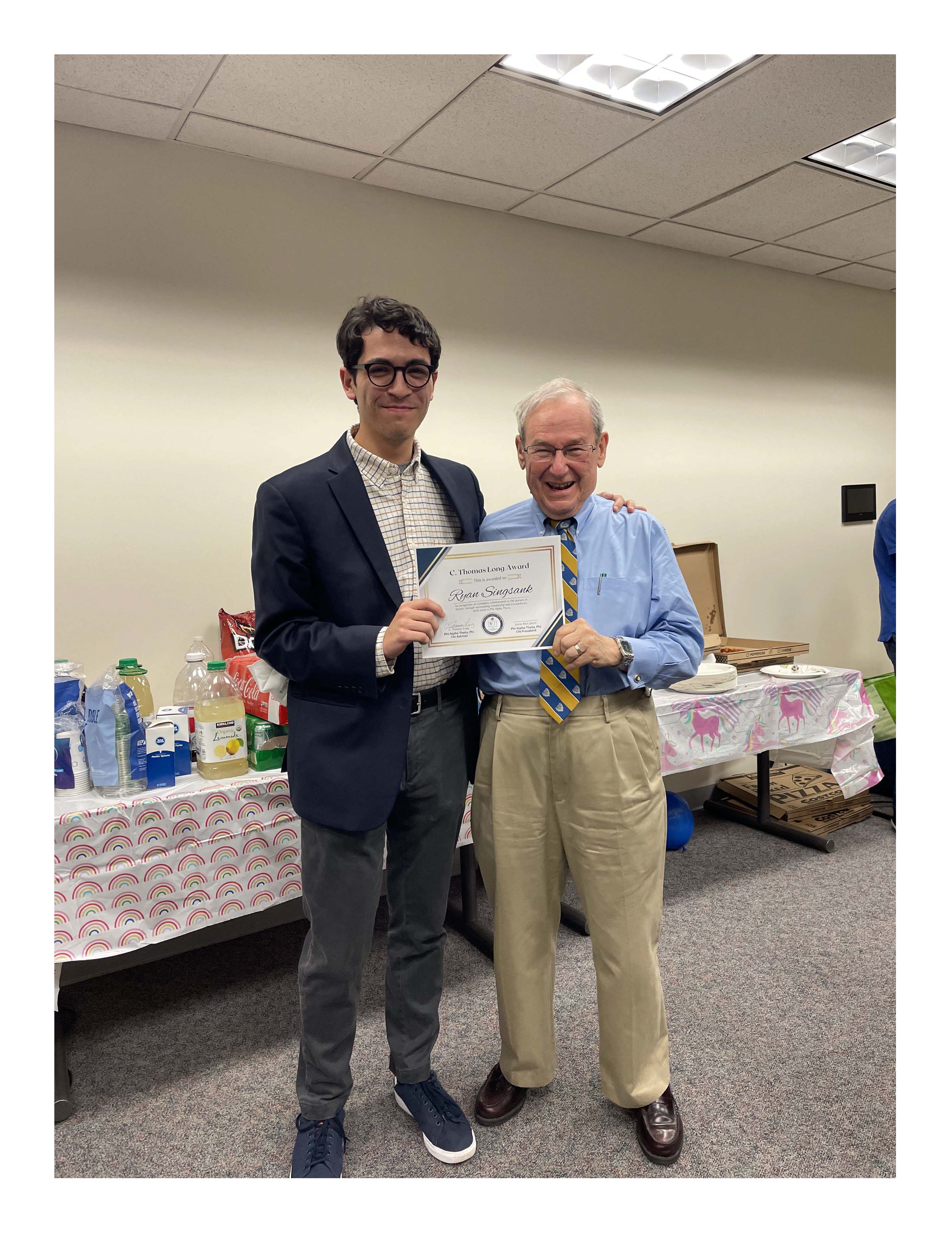 Ryan Singsank and Tom Long holding CTL Award