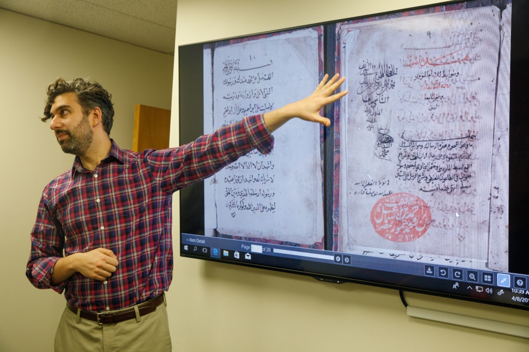 GW History Professor Pointing at Screen