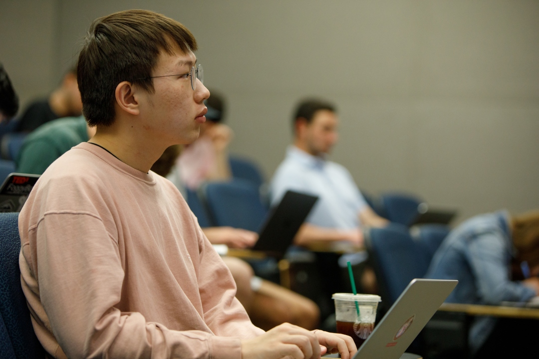 History student sits in a lecture hall.