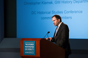 Christopher Klemek discussing D.C. historical studies at a podium.