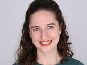 Headshot of Robin Pokorski on an off-white background