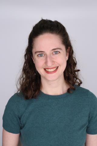 Headshot of Robin Pokorski on an off-white background