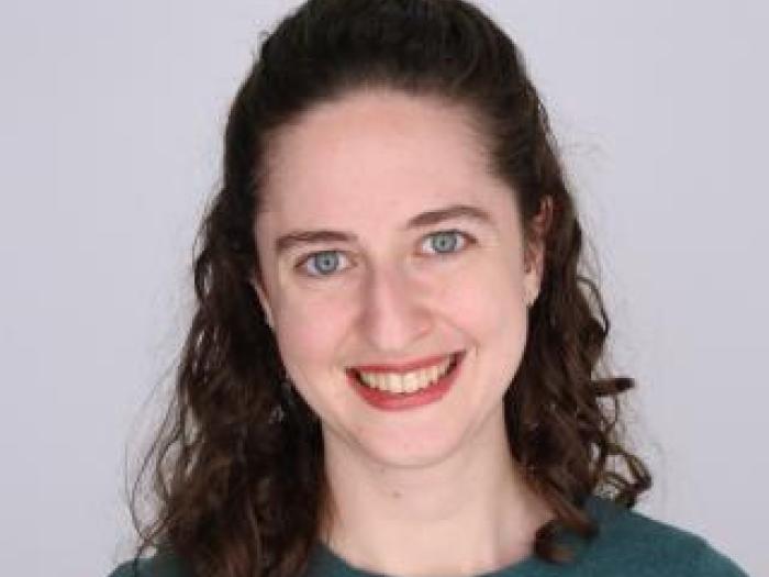 Headshot of Robin Pokorski on an off-white background