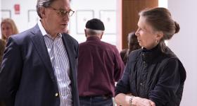 Sydney Blumenthal (left) talking with a female History faculty member (right)